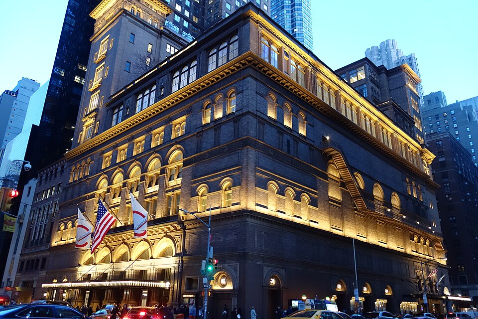 Carnegie Hall at Seventh Avenue and 57th Street in Midtown Manhattan near parking garages