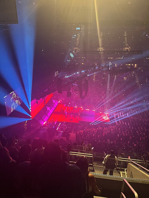 Live concert inside Barclays Center in Brooklyn, showing the scale, lighting, and atmosphere of a major arena performance
