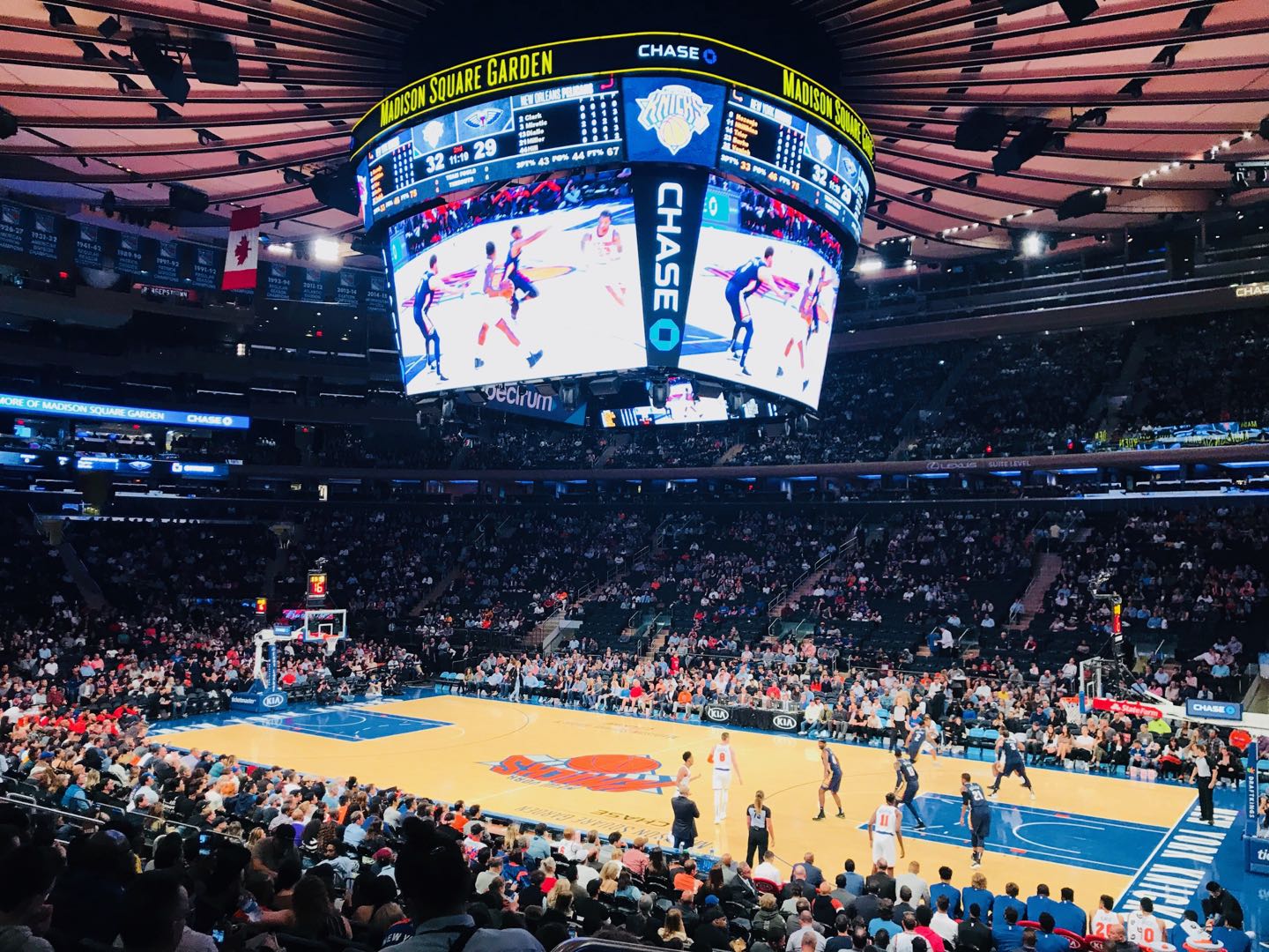 New York Knicks basketball game at Madison Square Garden with the court, crowd, and scoreboard visible