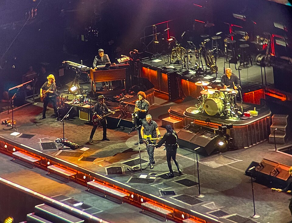 Live concert inside MetLife Stadium in East Rutherford, showing the scale, screens, and atmosphere of a major stadium performance