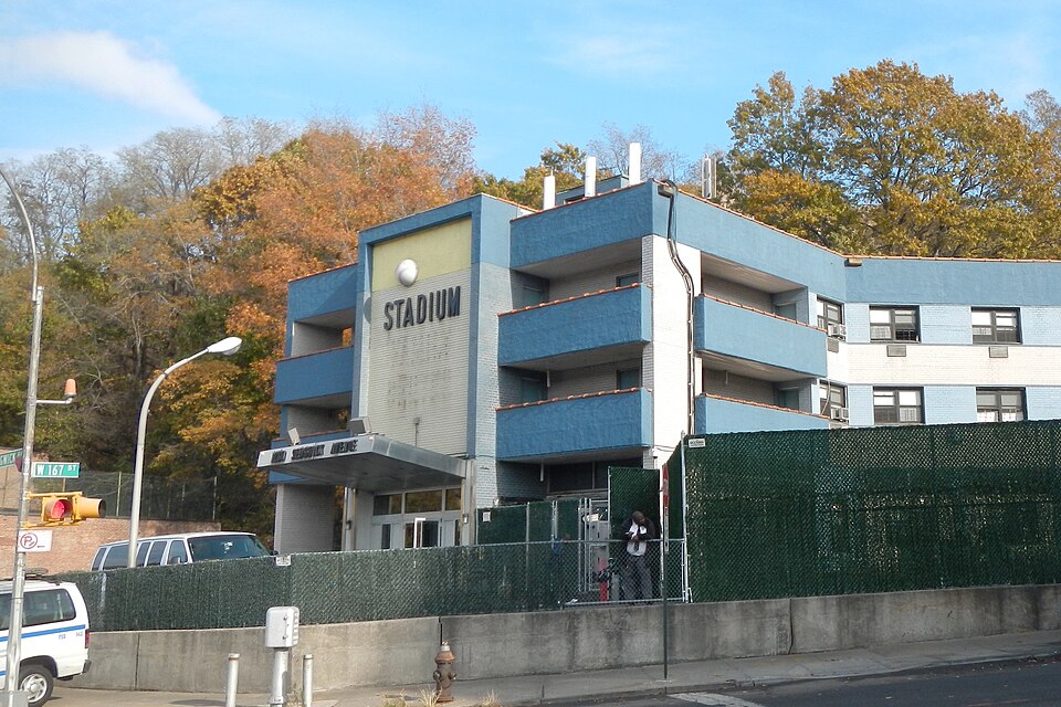 Hotel exterior in the Highbridge area of the Bronx near Yankee Stadium, showing a stay option for game-night visitors