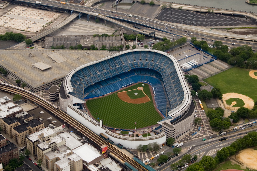 Aerial view of Yankee Stadium and the surrounding Bronx area, showing how the stadium fits into the neighborhood