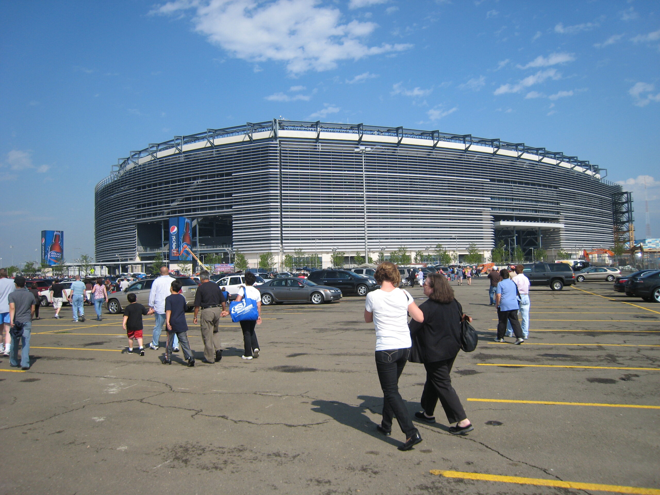 Fans walking through the MetLife Stadium parking lot before a Giants or Jets football game