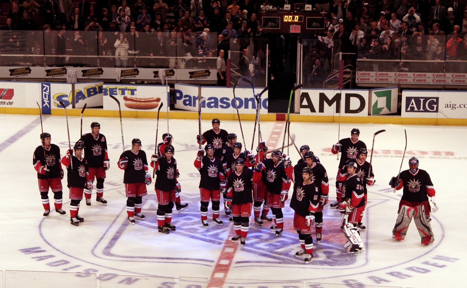 New York Rangers players salute the crowd after a game against the Islanders at Madison Square Garden