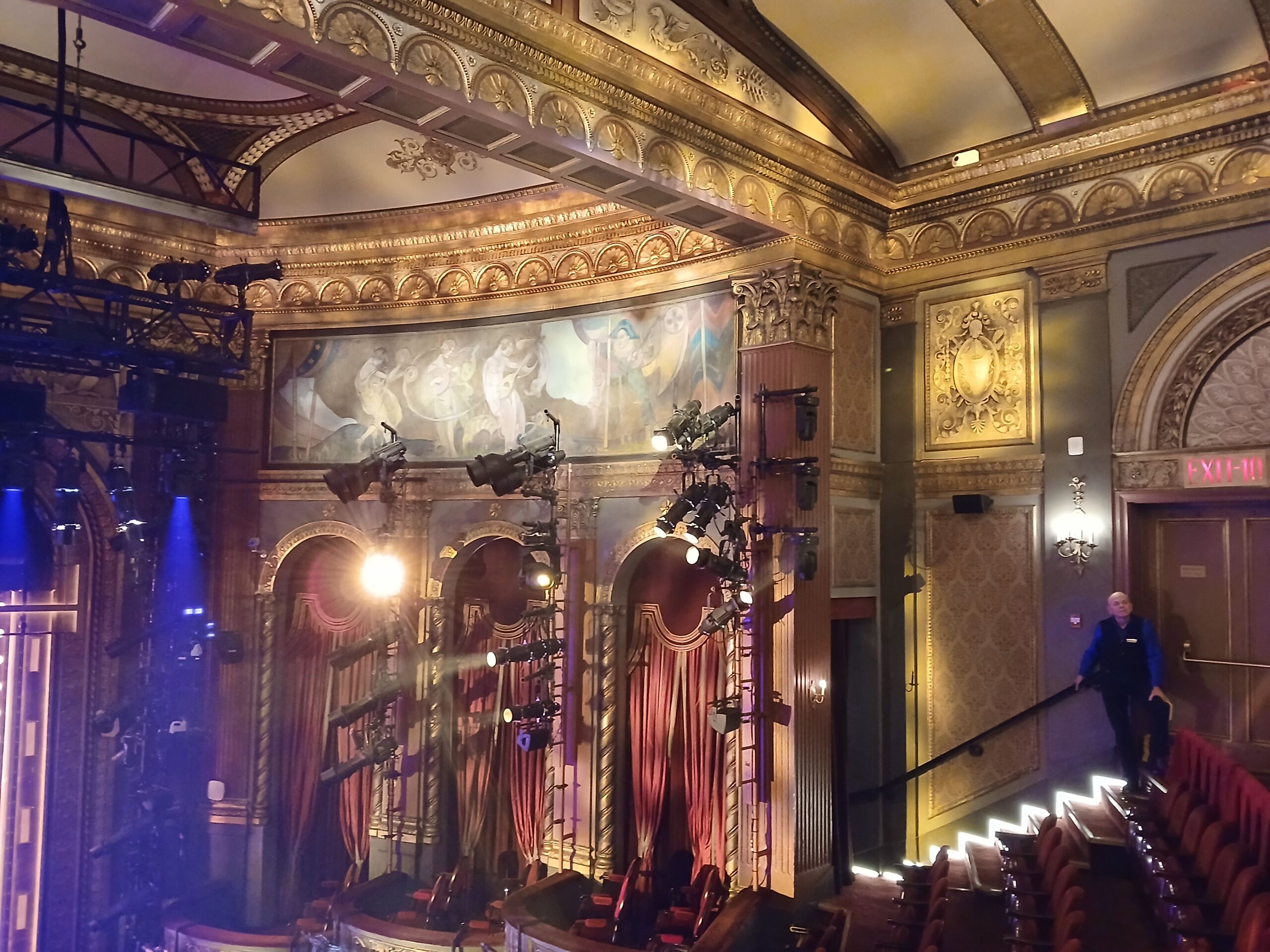 Interior view of Lena Horne Theatre in New York City showing the stage, orchestra seating, mezzanine, and SIX Broadway set