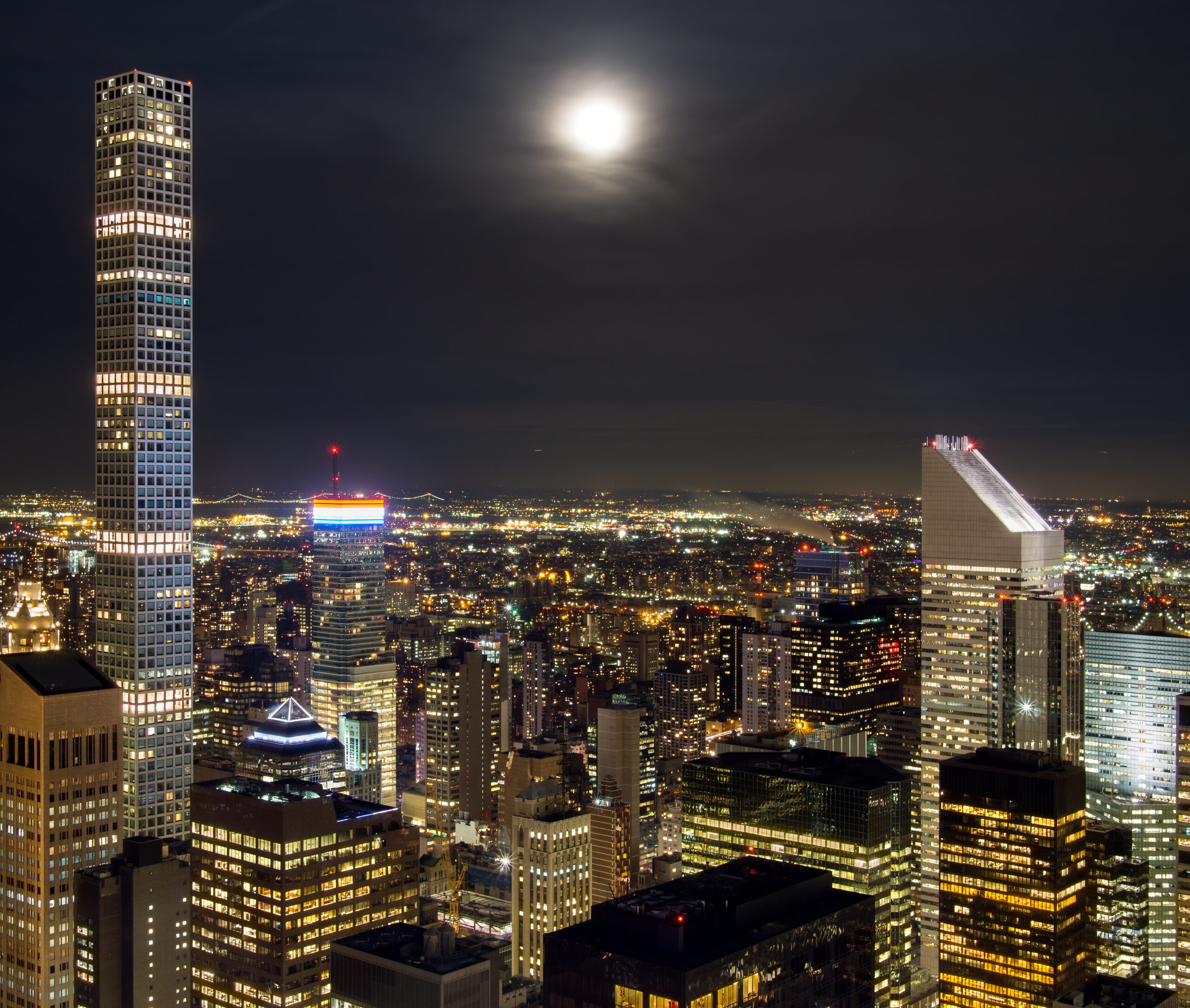 Midtown Manhattan at night, a central area for staying near NYC shows, concerts, events, and transportation