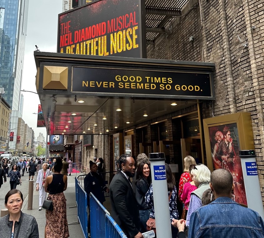 Broadway theater entrance with accessible ramp signage in New York City
