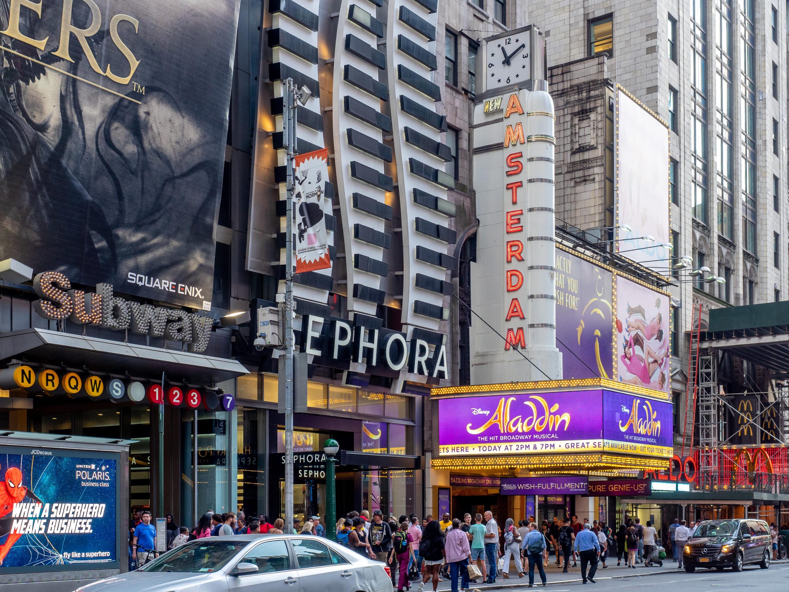 New Amsterdam Theatre with Aladdin signage in New York City, a family-friendly Broadway show option for kids.