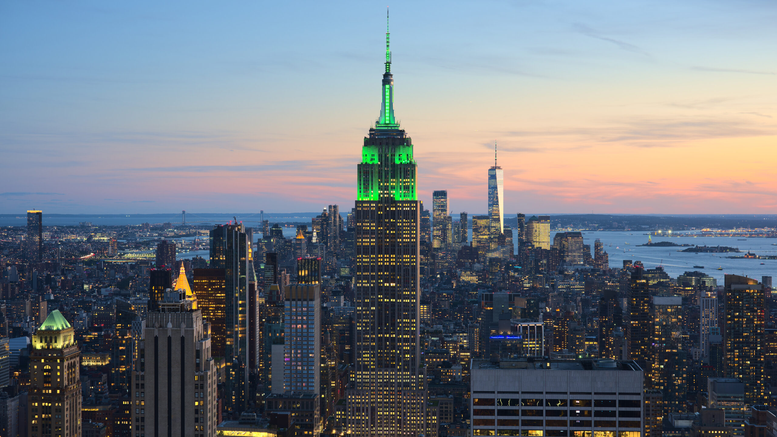 View of the Empire State Building and Midtown Manhattan skyline from Rockefeller Center, a classic first-time NYC itinerary stop.