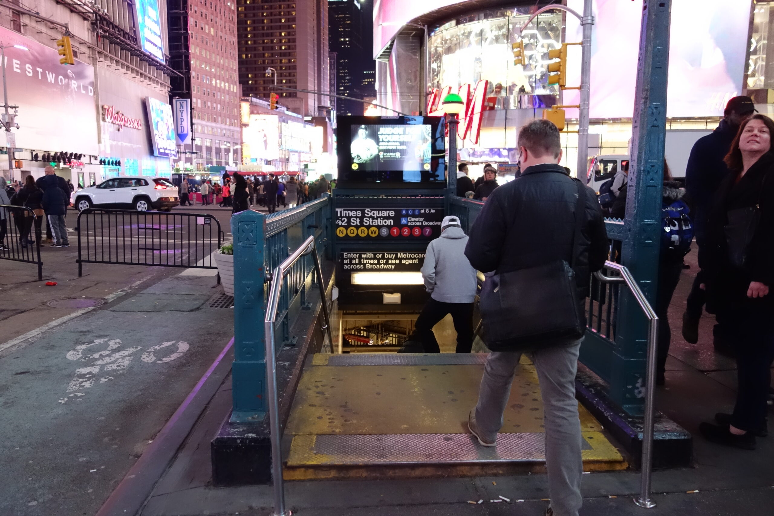Times Square subway entrance at night for getting home after a New York City show or late-night event