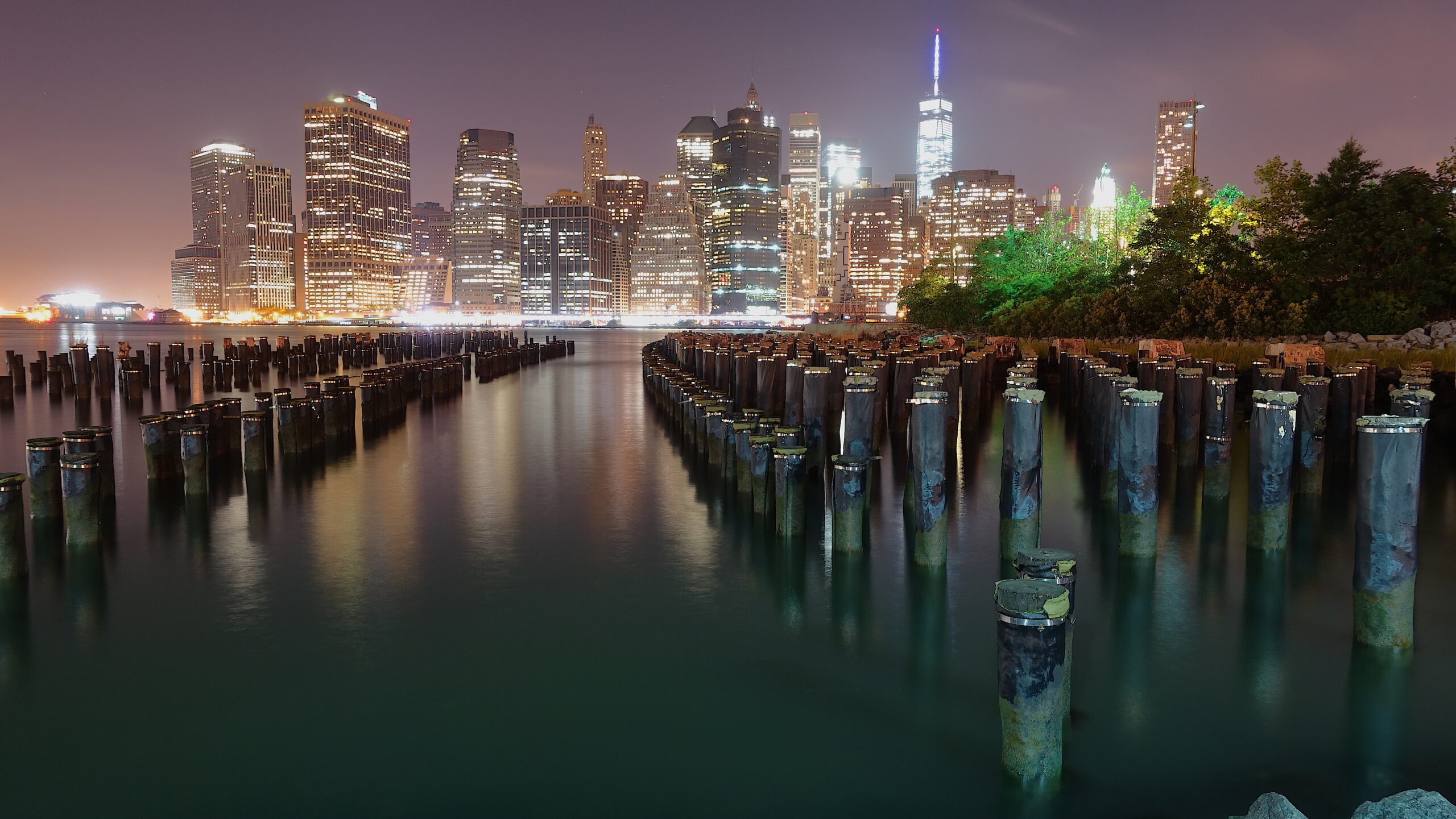 New York City skyline at night from Brooklyn Bridge Park for a weekend NYC itinerary.