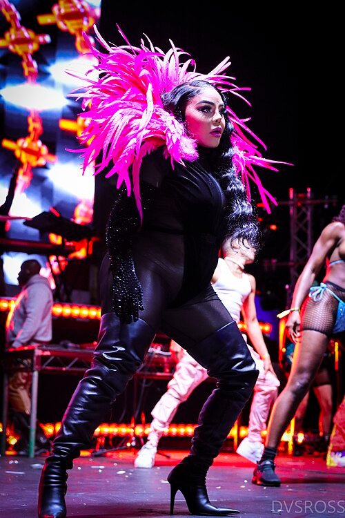 Lil' Kim performing live at WeHo Pride in 2022, ahead of her Hard Core Symphony concerts at Kings Theatre in Brooklyn