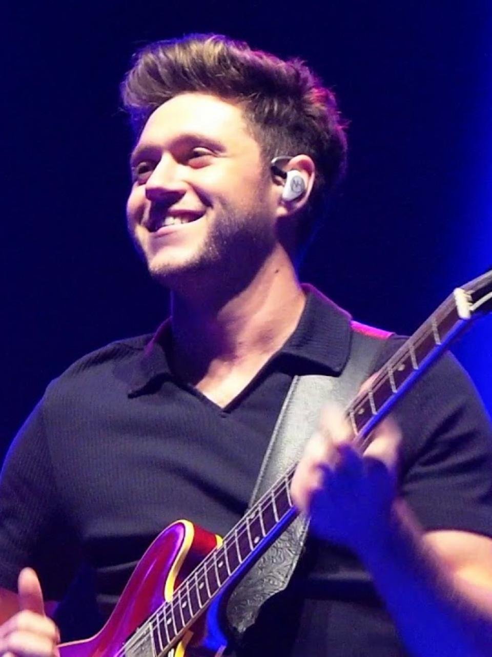 Niall Horan performing live during his solo concert tour, illustrating the setlist guide for his April 2027 Barclays Center show