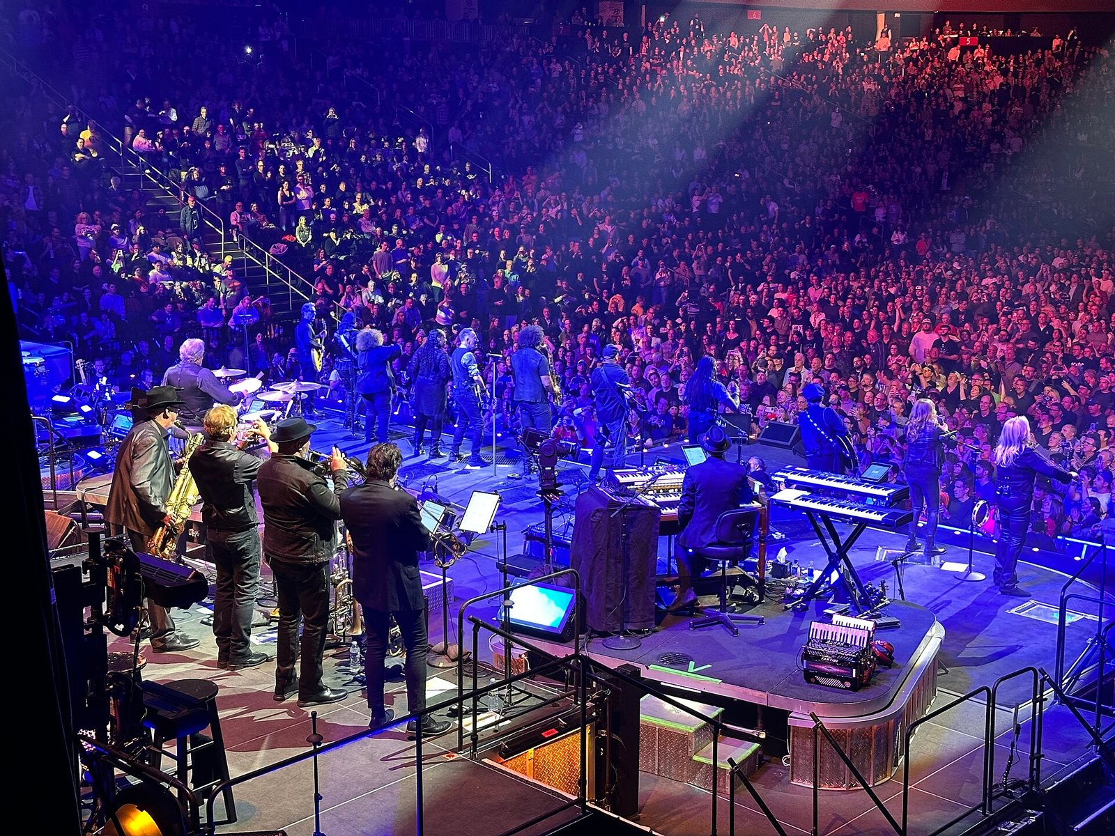 Live concert at Prudential Center in Newark, New Jersey, with musicians performing before a packed arena crowd